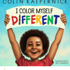 Drawing of a smiling boy holding a sign above his head that reads, "I Color Myself Different"