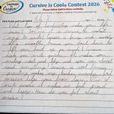 A lined paper with student cursive writing filling part of the page